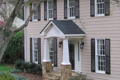 This is an example of a mid-sized traditional front door in Atlanta with a single front door and a black front door.
