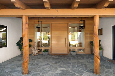 Example of a large transitional home design design in Other