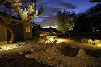 Inspiration for a mid-sized mediterranean drought-tolerant and full sun front yard gravel garden path in Los Angeles for spring.