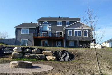 Inspiration for a large craftsman gray split-level wood exterior home remodel in Orange County with a shingle roof