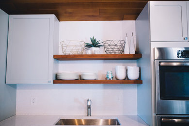 Mid-century modern kitchen photo in Seattle