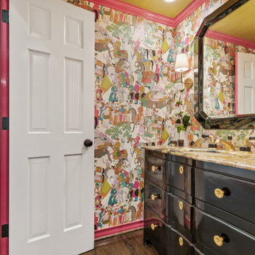 Vibrant and Eclectic Powder Room with Bold Wallpaper and Luxurious Vanity