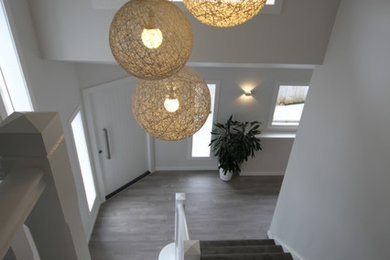 Design ideas for a large traditional straight staircase in Auckland.