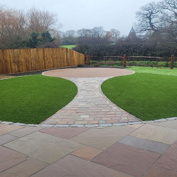 Raj Green Sandstone Patio and Artificial Grass