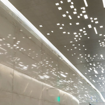 Reflection of light panels in mirrored tile wall