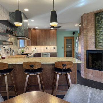 Birch Slab Door Kitchen with Green Tile, Hypnose Stone Tops, and MCM Lighting