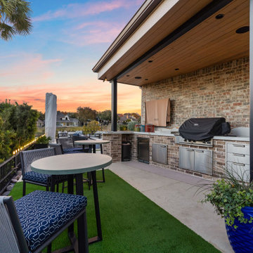 Custom Outdoor Living Pool Deck with Stamped Concrete & Turf