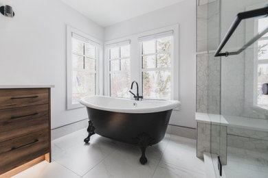 Large mid-century modern master gray tile and ceramic tile ceramic tile, white floor and double-sink bathroom photo in Edmonton with flat-panel cabinets, medium tone wood cabinets, white walls, a drop-in sink, quartz countertops, a hinged shower door, white countertops and a freestanding vanity