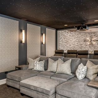 Inspiration for a mid-sized contemporary open concept dark wood floor and brown floor home theater remodel in Chicago with gray walls and a projector screen