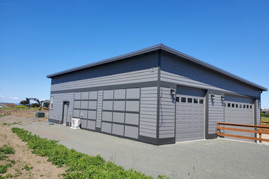 Large transitional detached four-car garage photo in Seattle