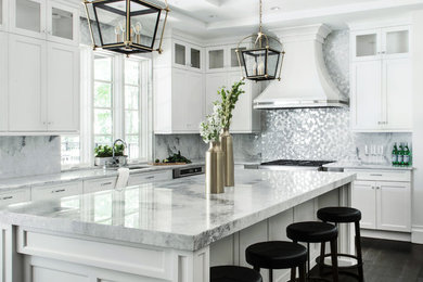 Design ideas for an expansive transitional kitchen in New York with an undermount sink, shaker cabinets, white cabinets, quartzite benchtops, stainless steel appliances, dark hardwood floors, with island and metallic splashback.