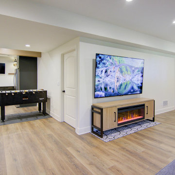 Warm & Inviting Basement Retreat with Kitchenette and Reading Nook