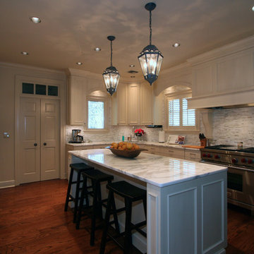 Wall of Pantry Cabinets and Island Storage Maximize Space in Woodmode Kitchen
