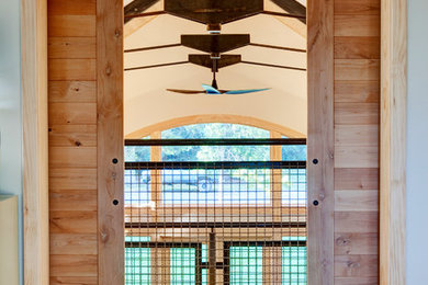 Inspiration for a large contemporary light wood floor hallway remodel in Other with white walls
