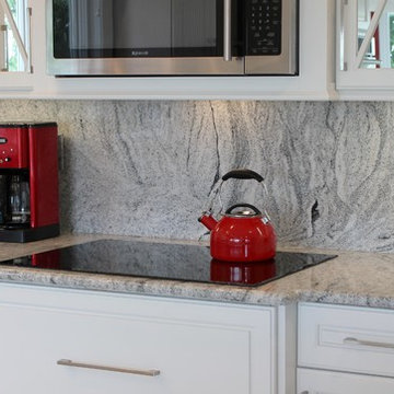 Geneseo, IL- Painted White Kitchen With Mirrored Cabinets and Full-Height Splash