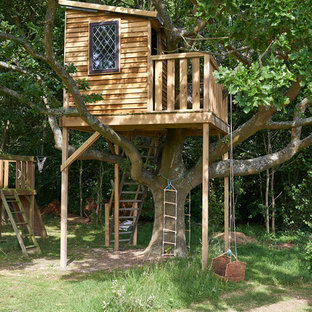 This is an example of a country garden in West Midlands with with outdoor playset.