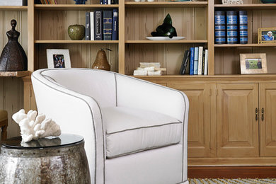 Study room - large traditional medium tone wood floor study room idea in New York with beige walls