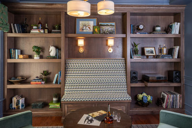 Example of an arts and crafts dark wood floor and gray floor family room design in Nashville with blue walls