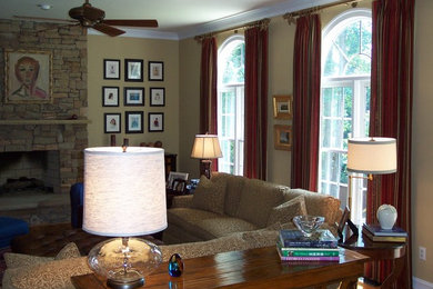 Inspiration for a large transitional open concept medium tone wood floor living room remodel in Richmond with a standard fireplace, a stone fireplace and a concealed tv