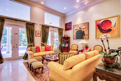 Example of a mid-sized classic formal and enclosed porcelain tile living room design in Miami with yellow walls, no fireplace and no tv