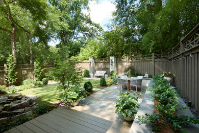 Example of a small trendy backyard stone patio design in Atlanta with no cover