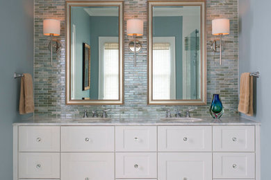 Design ideas for a mid-sized transitional 3/4 bathroom in Orange County with white cabinets, multi-coloured tile, glass tile, shaker cabinets, blue walls, porcelain floors, an undermount sink, marble benchtops, multi-coloured floor and a hinged shower door.