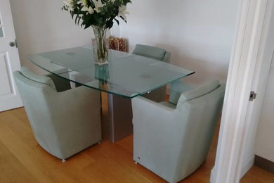 This is an example of a contemporary dining room in Surrey.
