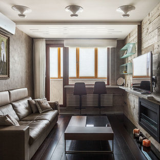 Свежая идея для дизайна: изолированная гостиная комната в современном стиле с темным паркетным полом, горизонтальным камином, фасадом камина из металла, коричневым полом, серыми стенами и отдельно стоящим ТВ - отличное фото интерьера