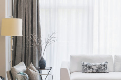 Inspiration for a small contemporary open concept light wood floor and gray floor living room remodel in Toronto with white walls, a standard fireplace, a wood fireplace surround and a media wall