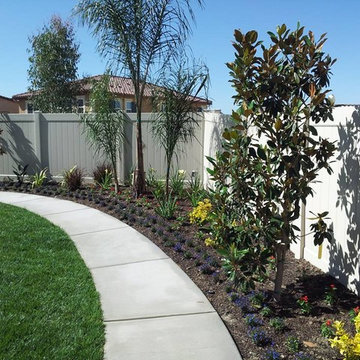 Landscaped Yard with Concrete Walkway and Sod