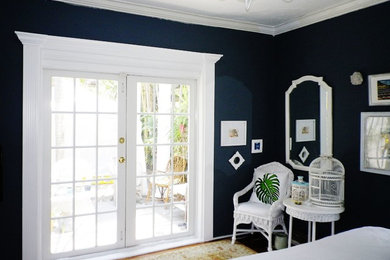 Bedroom - transitional master medium tone wood floor bedroom idea in Miami with gray walls