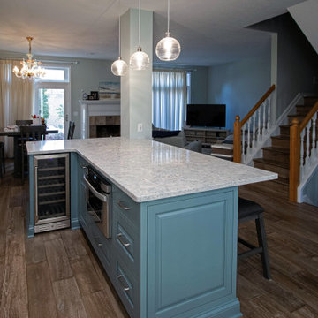 Coastal Kitchen with Custom Classic White Cabinetry and Teal Island