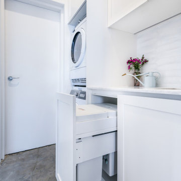 White laundry with pull out hampers