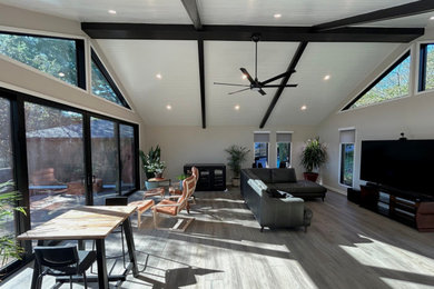 Example of a large transitional vinyl floor and gray floor sunroom design in DC Metro
