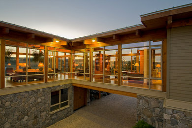 Example of a large trendy gray two-story mixed siding exterior home design in Calgary