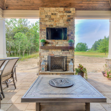 Outdoor Brick fireplace, wood paneled ceiling