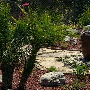 Backyard redesign with recirculating water feature urn.
