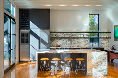 Open concept kitchen - large contemporary medium tone wood floor open concept kitchen idea in DC Metro with an undermount sink, shaker cabinets, gray cabinets, marble countertops, white backsplash, stone slab backsplash, stainless steel appliances and an island
