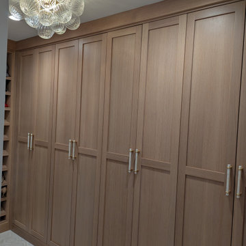 Amish Frameless White oak primary bath and closet with painted vanity