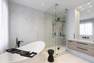 Bathroom - modern white tile and porcelain tile porcelain tile and double-sink bathroom idea in Toronto with flat-panel cabinets, light wood cabinets, quartz countertops, a hinged shower door and a floating vanity