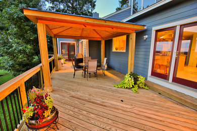 Inspiration for a mid-sized transitional backyard patio remodel in Richmond with decking and a pergola