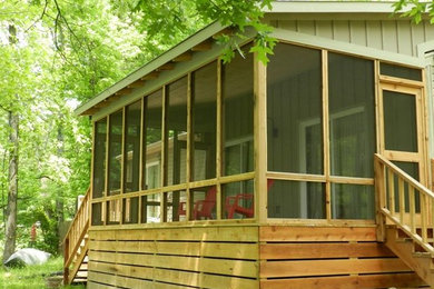 Mid-sized mountain style back porch idea in Nashville with decking