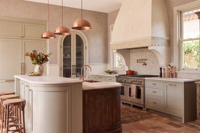 Inspiration for a large french country terra-cotta tile and red floor eat-in kitchen remodel in Miami with a drop-in sink, shaker cabinets, dark wood cabinets, quartzite countertops, white backsplash, ceramic backsplash, stainless steel appliances, an island and beige countertops