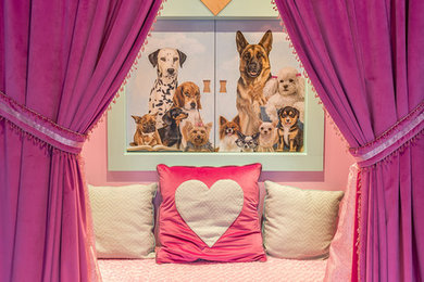 This is an example of a kids' playroom for girls in Boston with pink walls.
