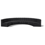 Meridian Furniture - Arc Vegan Leather Upholstered 8-Pc. Inward Curved Modular Sectional, Black - Unleash modern opulence with the Arc Vegan Leather 8pc. Sectional. Crafted for the modern connoisseur, this Sectional injects an air of refined luxury into any space. Its sleek silhouette, upholstered in supple black vegan leather, exudes timeless sophistication while the deep channel tufting adds textural intrigue, further elevating the chair's visual appeal. The modular design makes it a versatile chameleon, effortlessly adapting to your evolving needs and preferences. Whether you envision it gracing a chic living room corner, basking in the glow of a bedroom window, or adding a touch of drama to a home office, the Arc seamlessly complements your unique interior aesthetic.