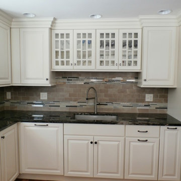 Traditional White Kitchen Remodel with Cook top in the peninsula