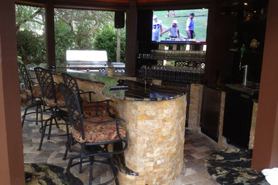 Inspiration for a modern home bar remodel in Tampa