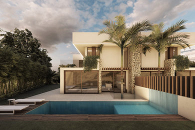 Modelo de piscina alargada actual de tamaño medio rectangular en patio delantero con paisajismo de piscina y suelo de baldosas