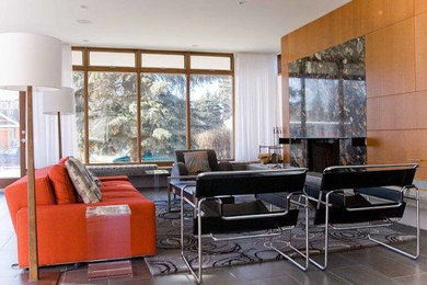 This is an example of a large midcentury formal open concept living room in Calgary with white walls, ceramic floors, a standard fireplace and a tile fireplace surround.