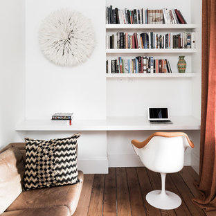 Photo of a mid-sized home office in Sydney with white walls, dark hardwood floors and a built-in desk.